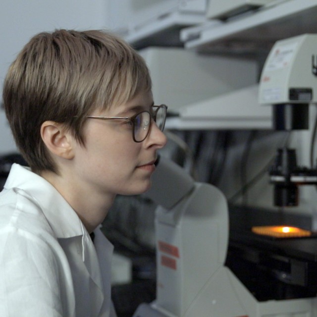 Margo MacDonald operates a fluorescence microscope